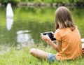 Girl with remote controlled boat Royalty Free Stock Photo