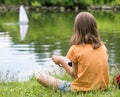 Girl with remote controlled boat Royalty Free Stock Photo