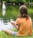 Girl with remote controlled boat Royalty Free Stock Photo