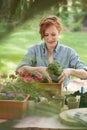 Girl replanting flowers Royalty Free Stock Photo