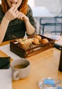 The girl in the restaurant eats mini burgers and fries. Royalty Free Stock Photo