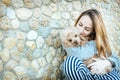 Girl is resting with a dog on the outdoors. Royalty Free Stock Photo