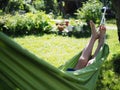 Girl resting lying in a hammock