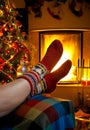 Girl resting in room with fireplace Christmas