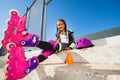 Girl resting on the steps of outdoor rollerdrom Royalty Free Stock Photo