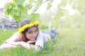 Girl resting on a sunny day in meadow of yellow dandelions Royalty Free Stock Photo