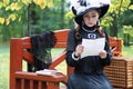 Girl in retro dress past century read letter on the bench Royalty Free Stock Photo