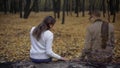 Girl returning to place of dates and feeling spirit of presence of her beloved