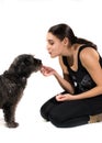 Girl rewarding dog Royalty Free Stock Photo