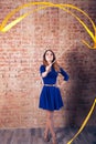 Girl with a ribbon. Brick wall Royalty Free Stock Photo