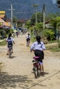 Girl ridding a bicycle in her way to the school Royalty Free Stock Photo