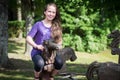 A girl ridding on a wooden horse