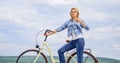 Girl ride cruiser bicycle. Woman rides bicycle sky background. Reasons to ride bike. Benefits of cycling every day. Keep