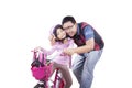 Girl rides bicycle with her dad Royalty Free Stock Photo