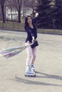 Girl rides on roller skates. Royalty Free Stock Photo