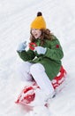 Girl rides sledge down hill Royalty Free Stock Photo