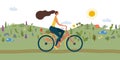 Girl riding bicycle. Park. meadow and hills on background Royalty Free Stock Photo