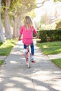 Girl Riding Bike Along Path Royalty Free Stock Photo