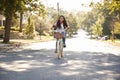 Girl Riding Bike Along Street To School Royalty Free Stock Photo