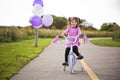 Girl riding a bycicle Royalty Free Stock Photo