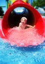 Girl riding down the water slide Royalty Free Stock Photo