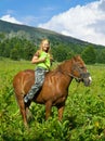 Girl riding a horse bareback