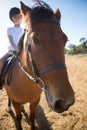 Girl riding a horse in the ranch Royalty Free Stock Photo