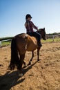 Girl riding a horse in the ranch Royalty Free Stock Photo