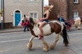 Girl riding a horse in the street at Appleby Horse Fair 2019