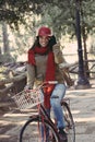 Girl riding retro bicycle at park on fall season Royalty Free Stock Photo