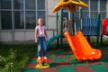 Girl riding rides on a child playground