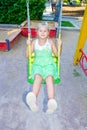 Girl riding on a swing Royalty Free Stock Photo