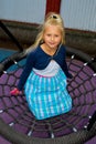 Girl riding on a swing Royalty Free Stock Photo