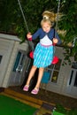 Girl riding on a swing Royalty Free Stock Photo