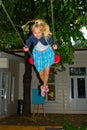 Girl riding on a swing Royalty Free Stock Photo