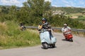 Girl riding vintage scooter Vespa Royalty Free Stock Photo