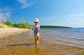 Girl at river shore Royalty Free Stock Photo