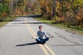 Girl, road and autumn forest, Marinette county; Wisconsin; Royalty Free Stock Photo