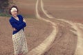 Girl on the road in field Royalty Free Stock Photo