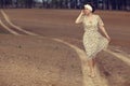 girl on the road in field Royalty Free Stock Photo