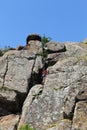 Girl rock climber climbs on rock