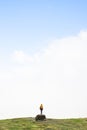 Girl on a rock looking for the way forward in fog in the Pyrenees National Park, France. Concept of looking for solutions Royalty Free Stock Photo