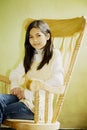 Girl in rocking chair Royalty Free Stock Photo
