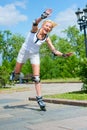 Girl roller-skating in the park Royalty Free Stock Photo