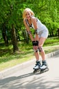 Girl roller-skating in the park