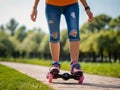 A girl rollerblades along a path in the park, Royalty Free Stock Photo