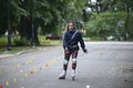 Girl rollerblading in a park