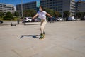 Girl rollerblading wearing covid facemask. Coronavirus protection virus. Outdoor fitness exercise