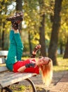 Girl on the rollers have fun in city summer park, enjoying healthy lifestile