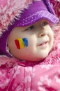 Girl with Romanian flag face-painted